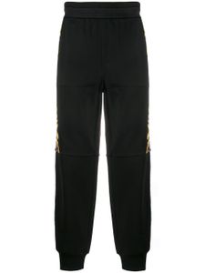 Versace pantalon de jogging à logo baroque - Noir