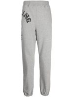 A BATHING APE® pantalon de jogging fuselé à logo - Gris