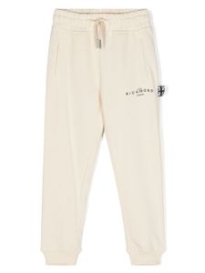 John Richmond Junior pantalon de jogging en coton à logo imprimé - Tons neutres