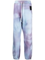 OAMC pantalon de jogging à imprimé tie dye - Bleu