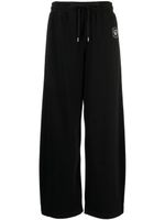 Stella McCartney pantalon de jogging en coton à patch logo - Noir