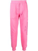 Alexander McQueen pantalon de jogging à logo imprimé - Rose