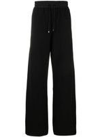 Saint Laurent pantalon de jogging en coton à coupe ample - Noir