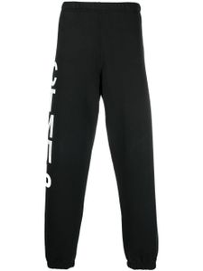 Heron Preston pantalon de jogging à logo СТИЛЬ imprimé - Noir