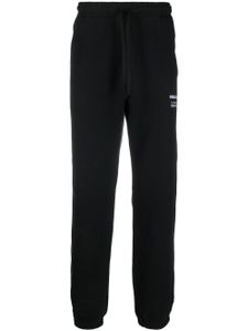 Maharishi pantalon de jogging à logo brodé - Noir