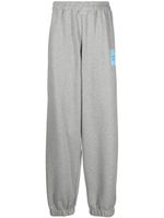 VETEMENTS pantalon de jogging ample à logo imprimé - Gris