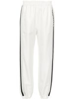 Moncler logo-embroidered track pants - Tons neutres