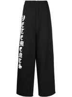 VETEMENTS pantalon de jogging ample à logo imprimé - Noir