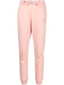 Armani Exchange pantalon de jogging à logo strassé - Rose