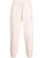 MONOCHROME logo-print cotton track pants - Tons neutres