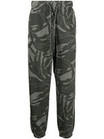 AAPE BY *A BATHING APE® pantalon fuselé à imprimé graphique - Vert