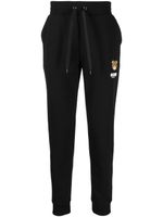 Moschino pantalon de jogging à patch logo - Noir