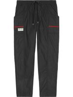 Gucci pantalon de jogging fuselé à détails Web - Noir