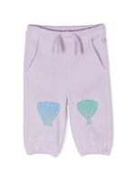 Stella McCartney Kids pantalon de jogging en coton à fleurs - Violet