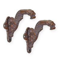 A PAIR OF CAST IRON COAT HOOKS