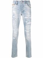 Philipp Plein jean skinny à finitions effilochées - Bleu