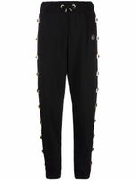 Philipp Plein pantalon de jogging clouté à patch logo - Noir