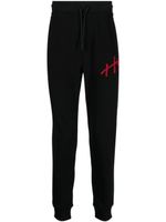 HUGO pantalon de jogging à logo appliqué - Noir