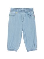 Stella McCartney Kids jean à imprimé Sunshine Face - Bleu