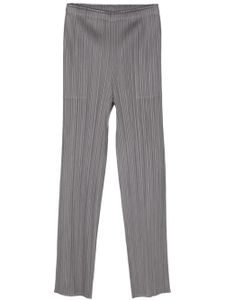 Pleats Please Issey Miyake pantalon en satin à design plissé - Gris