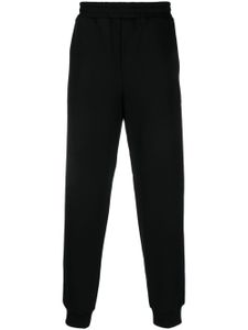 Helmut Lang pantalon de jogging en coton à logo imprimé - Noir