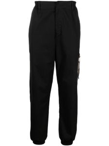 Moschino pantalon fuselé à design stretch - Noir