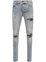 AMIRI jean skinny MX1 à effet usé - Bleu