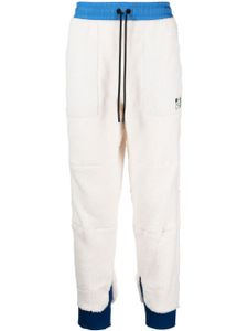 Moncler Grenoble pantalon de jogging à lien de resserrage - Blanc