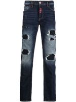 Philipp Plein jean slim à finitions effilochées - Bleu