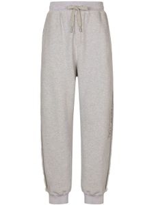 Dolce & Gabbana pantalon de jogging en coton à logo imprimé - Gris