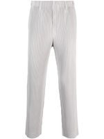 Homme Plissé Issey Miyake pantalon droit à effet plissé - Gris