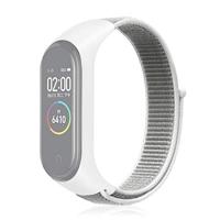 By Qubix - Nylon Geweven Bandje Compatible met Xiaomi Mi Band 3/4 / 5/6 / 7 - Wit - Compatible Xiaomi bandje