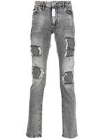 Philipp Plein jean slim à finitions effilochées - Gris