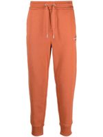 Calvin Klein Jeans pantalon de jogging à logo brodé - Orange