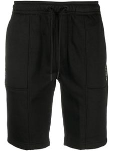 Calvin Klein Jeans pantalon de jogging à logo imprimé - Noir