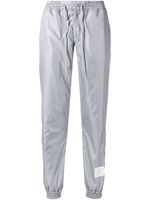 Thom Browne pantalon de jogging à détail rayé - Gris