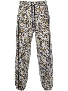 Eckhaus Latta pantalon de jogging en polaire à imprimé graphique - Gris