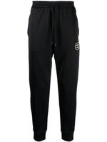 Emporio Armani pantalon de jogging à patch logo - Noir