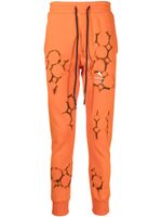 Mauna Kea pantalon de jogging à logo imprimé - Orange