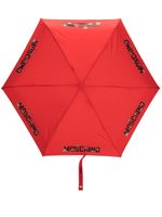 Moschino parapluie à logo imprimé - Rouge