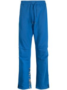 Maharishi pantalon en coton à imprimé graphique - Bleu