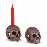 A CAST IRON SKULL CANDLE HOLDER, OLD SILVER