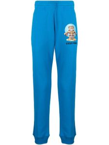 Moschino pantalon de jogging en coton à logo imprimé - Bleu