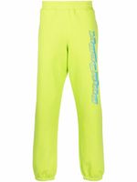 Moschino pantalon de jogging à logo imprimé - Vert