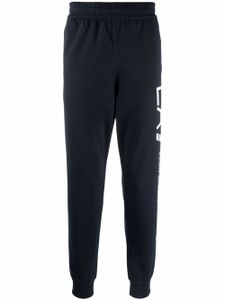 Ea7 Emporio Armani pantalon de jogging à logo imprimé - Bleu