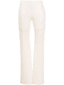 Chloé pantalon en dentelle à coupe évasée - Tons neutres