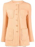 CHANEL Pre-Owned veste sans col en tweed à boutons CC - Orange