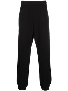 Versace pantalon de jogging à logo brodé - Noir