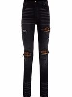 AMIRI jean skinny à finitions effilochées - Noir - thumbnail