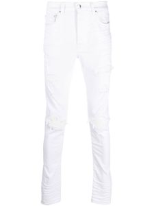 AMIRI jean skinny à effet usé - Blanc